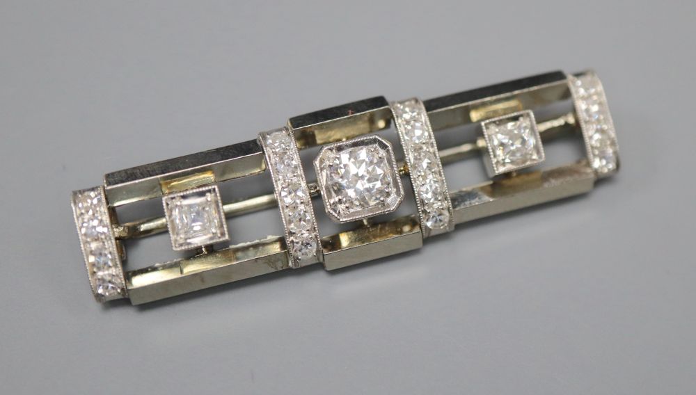 An Art Deco style 585 white and yellow metal, diamond cluster set rectangular bar brooch, 4cm, gross 7.1 grams, makers mark, RR.